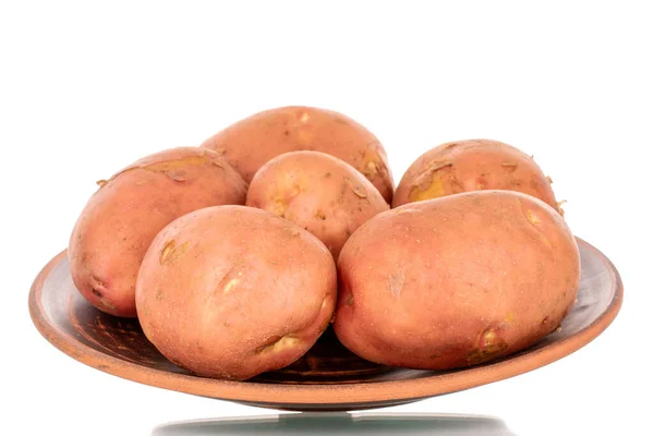 Αρκετές Οργανικό Ροζ Ακατέργαστες Πατάτες Ένα Πιάτο Πηλό Μακροεντολή Απομονώνονται — Φωτογραφία Αρχείου