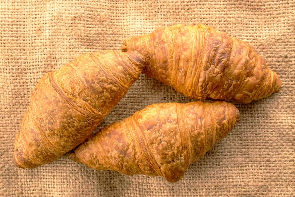 Three Delicious Croissants Chocolate Filling Jute Fabric Close Top View — Stock Photo, Image