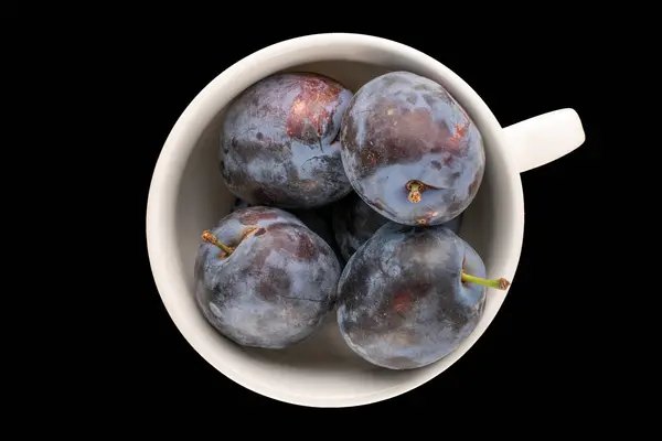 Several Sweet Ripe Plums White Ceramic Cup Black Background Macro — Stock Photo, Image
