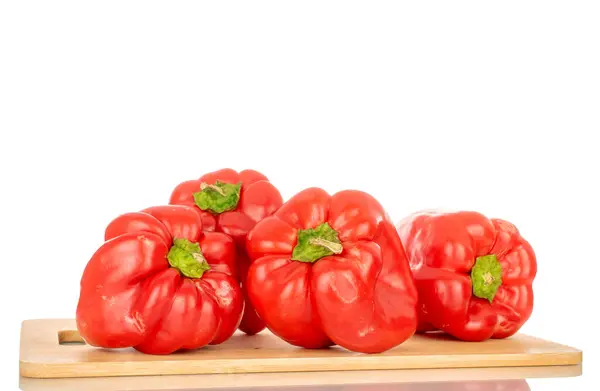 Four Red Sweet Peppers Bamboo Kitchen Board Macro Isolated White — Stock Photo, Image