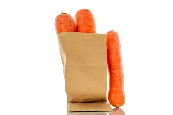 Three Sweet Carrots Paper Bag Macro Isolated White Background — Stock Photo, Image