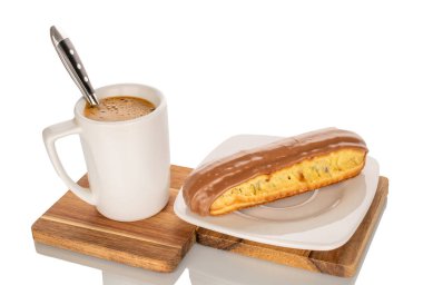 One eclair with cream filling on a ceramic saucer with a cup of coffee, close-up, isolated on a white background. clipart