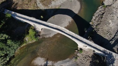 Old stone bridge of Aziz Aga, Venetikos river, aerial view, Grevena, Macedonia, Greece