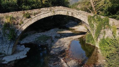 Old stone bridge Kaber Aga, Zagoritikos river, aerial view, Zagori, Epirus, Greece