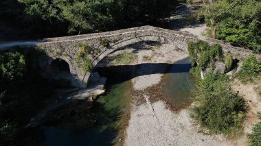 Old stone bridge Kaber Aga, Zagoritikos river, aerial view, Zagori, Epirus, Greece