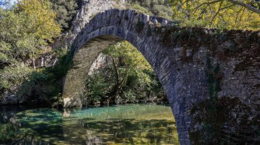 Old stone bridge of Kleidonia, Voidomatis river, Vikos gorge, Zagori Ioannina, Epirus, Greece