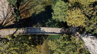 Old stone bridge of Kleidonia, Voidomatis river, aerial view, Vikos gorge, Zagori Ioannina, Epirus, Greece
