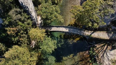 Old stone bridge of Kleidonia, Voidomatis river, aerial view, Vikos gorge, Zagori Ioannina, Epirus, Greece