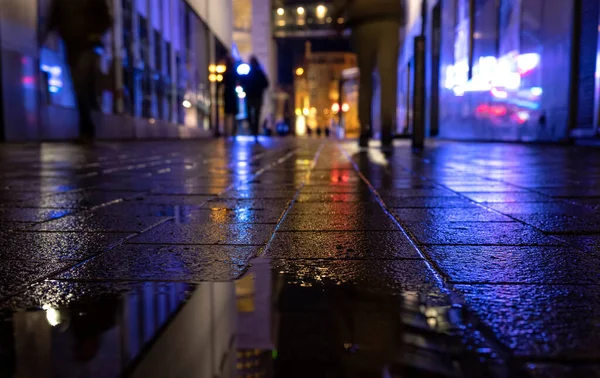 the street with lights and blurred reflections