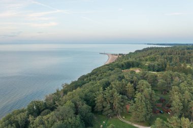 Toila, Estonia - 10.08.2022: Top view of Narva Bay on a summer evening. Toila Oru Park. The sky is a pastel color. The rich greenery of the park. Space for text. Natural background.