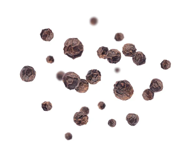 stock image Pepper seeds in a random position in the air on a white background 