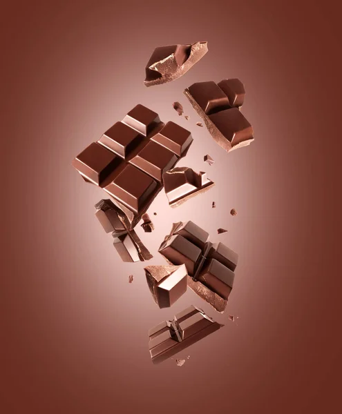 Törött Szelet Étcsokoládé Levegőben Barna Alapon — Stock Fotó
