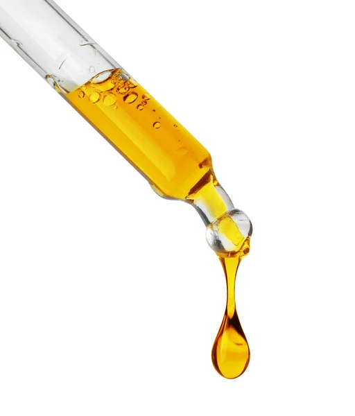Tropfen Einer Gelben Öligen Flüssigkeit Tropfen Aus Einer Pipette Isoliert — Stockfoto