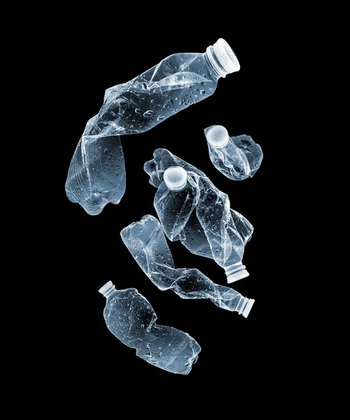 黑暗中的一组照明塑料瓶 — 图库照片