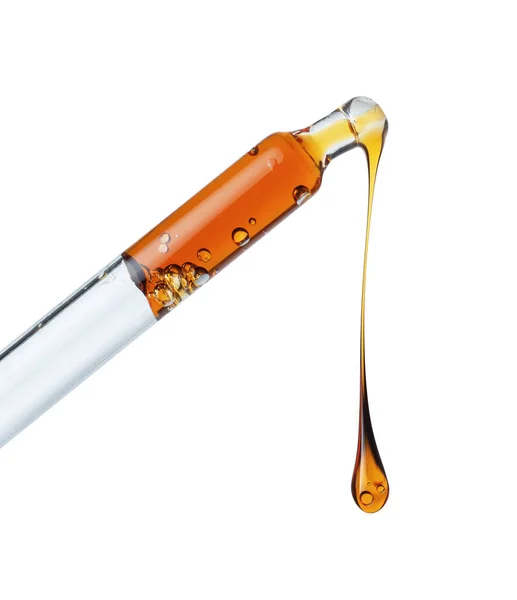 Druppel Van Een Gele Olieachtige Vloeistof Druppelend Uit Een Pipet — Stockfoto