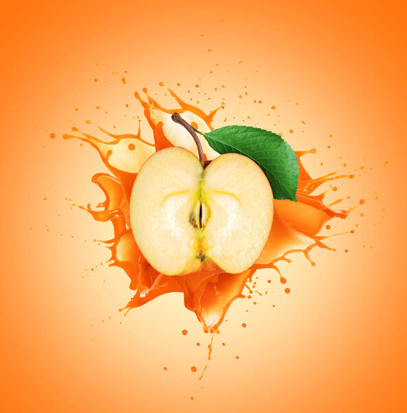 Half of an apple with juice splashes 