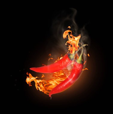 Kavurucu ateşte iki kırmızı biber Karanlığa yakın