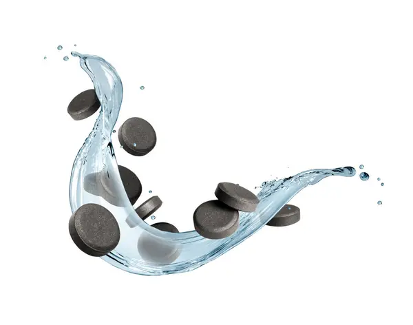 stock image Activated charcoal pills with splash of water isolated on a white background