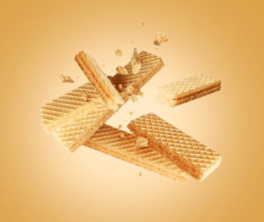 Sarı arka planda ezilmiş gevrek waffle 'lar.