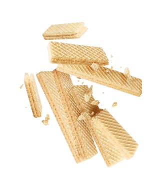 Bir grup çıtır waffle havada ezilmiş yakın plan beyaz arka planda izole edilmiş.