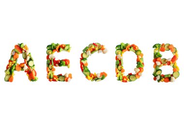 Vitamins A,E,C,D,B in the form of letters made of vegetables clipart