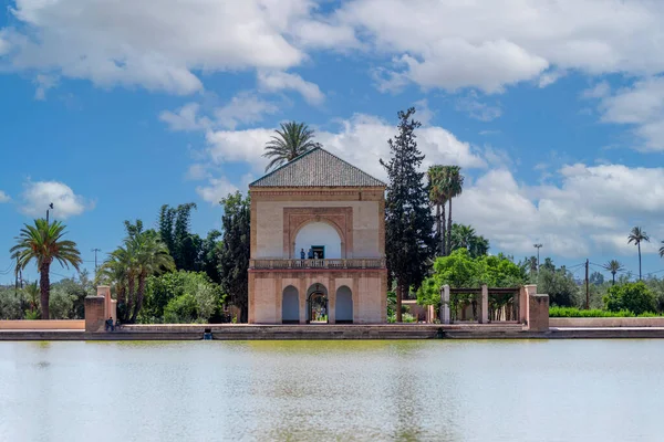 stock image Photograph of the Menara Gardens which are the most famous gardens of Marrakech and one of the most visited and touristic places in Morocco with a fortress and a lake.