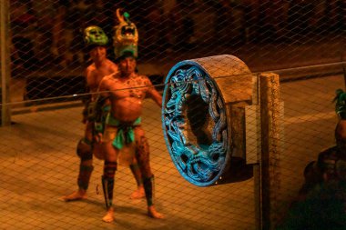 Basket of the Mayan ball game where warriors prepare to play in the ancient ruins belonging to this civilization in the tropical jungle of the Mayan Riviera, in the show performed by the Xcaret park.