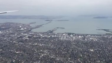 Flight over the city of San Francisco in the United States of America from where you can see the city and the bay from the sky, it is a city in the state of California, USA.