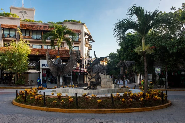 Traffic circle with a statue on the fifth avenue of Playa del Carmen in the famous Mayan Riviera of Mexico, this is an ideal place for vacation and summer tourism.