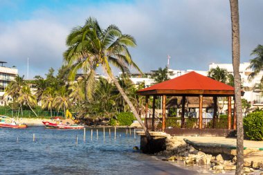 A viewpoint overlooking the Caribbean Sea on a white beach in the Mayan Riviera of Mexico, this is an ideal place for summer vacations and tourism.