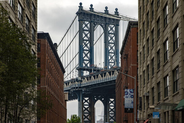 New York, USA; June 3, 2023: Dumbo is a trendy Brooklyn neighborhood with cobblestone streets and offers picturesque views of the Manhattan skyline and bridge.