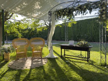 Exchange heartfelt vows beneath the warm glow of the sun at our enchanting outdoor altar. Celebrate your love surrounded by the beauty of nature on a perfect sunny day. clipart