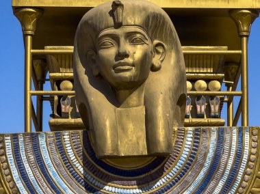 The imposing head of an Egyptian deity adorns the prow of the solar boat as it sails along the Avenue of the Sphinxes. This boat was used for sacred rituals and processions in ancient Thebes. clipart