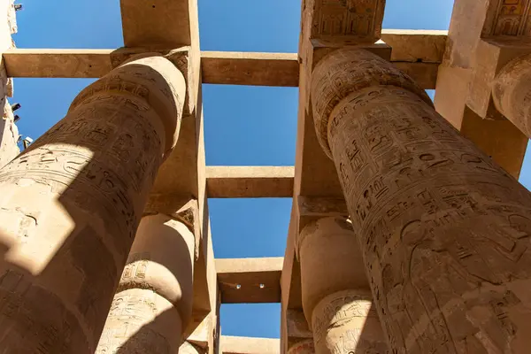 stock image These towering pillars in Karnak's Great Hypostyle Hall stand as timeless testaments to ancient Egypt's grandeur and engineering prowess.