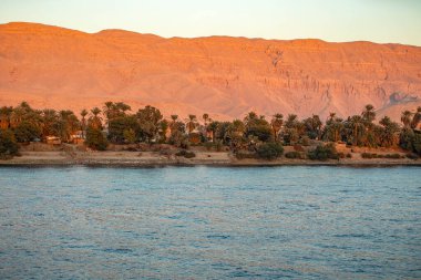 The soul of Egypt on a Nile cruise. Our journey from Luxor to Aswan through fertile lands and ancient wonders. With breathtaking views of the Nile River as it meanders through the arid desert. clipart