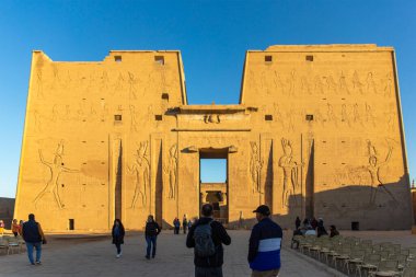 Edfu, Egypt; January 17, 2024: Discover the mythical city of Edfu, home to Horus' temple. Immerse yourself in ancient Egyptian mythology as you explore this sacred site where gods and mortals once. clipart