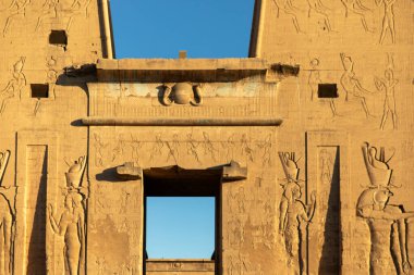 Explore the ancient temple of Horus in Edfu, a sacred sanctuary where the falcon god once resided. Immerse yourself in the rich history and mythology of ancient Egypt. clipart