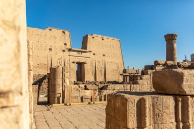 Edfu, Egypt; January 17, 2024: Discover the serene sands of Edfu and explore the timeless temple of Horus. This ancient sanctuary offers a peaceful retreat and a glimpse into the past. clipart