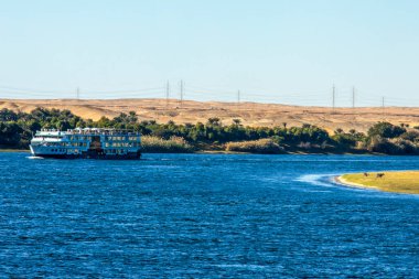 Experience Nile Opulence on a luxurious river cruise. Sail along the Nile and marvel at the lush, fertile banks while enjoying world-class amenities and impeccable service. clipart