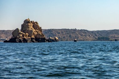 Discover the serene stone islets of the Nile River near Elephantine Island in Aswan. These small islands offer tranquil views of the Nile near Elephantine Island, Aswan. clipart