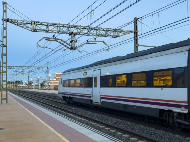 Villarrobledo, Spain; November 7, 2024: Explore the three Renfe trains and railroads in Castilla-La Mancha: Train Arrivals. Experience the arrival of medium and long distance trains to the stations. clipart