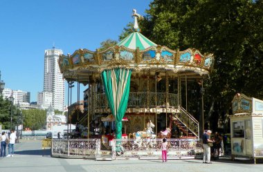 Spain, Madrid, Calle de Bailen, playground with a carousel