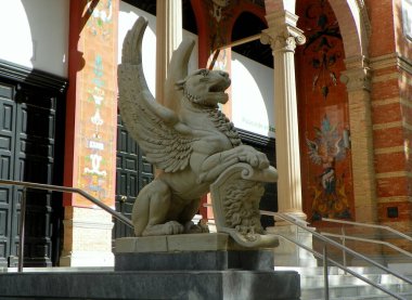 Spain, Madrid, El Retiro Park, Palacio de Velazquez (Velazquez Palace), winged lion at the entrance