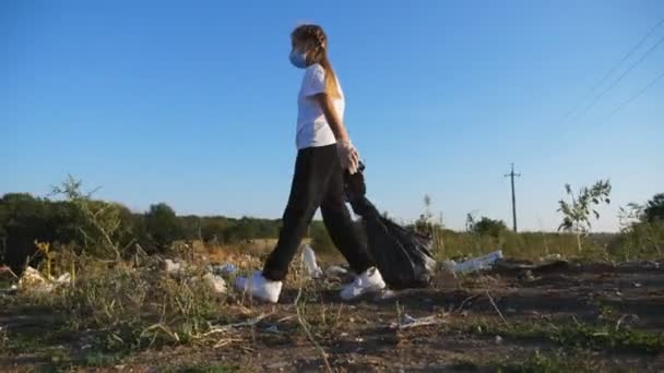 Little Bad Girl Mask Carrying Big Bag Garbage Throwing Landfill — Stock Video