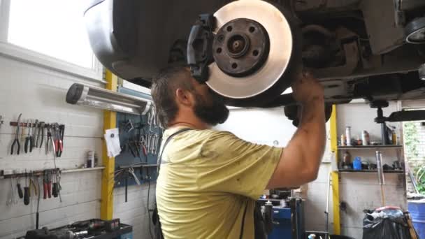 Auto Mechanic Fixing Suspension Car Garage Professional Bearded Repairman Uniform — Stock Video