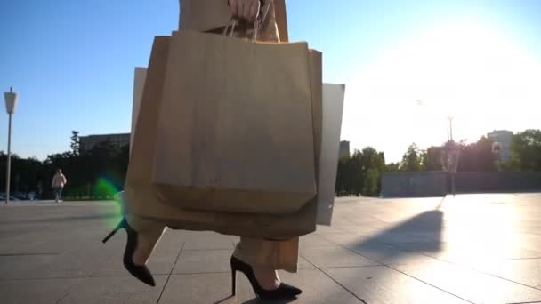 Young Female Customer Holds Shopping Bags Walking Sidewalk Purchases Fashionable — Stockvideo