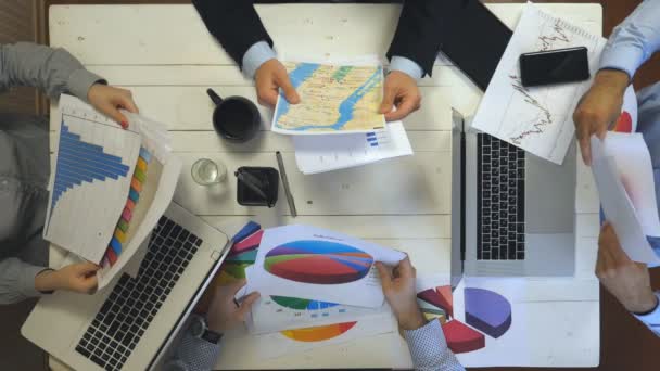 Hands Business People Sitting Table Trendy Office Examining Graphs Group — Vídeo de stock