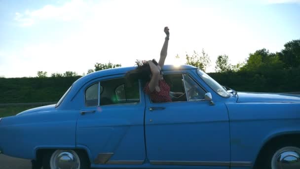 Attractive Girl Sunglasses Leaning Out Vintage Car Window Enjoying Trip — Stock Video