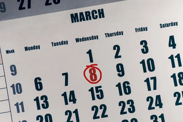 Calendar with a red circle around the number 8. Happy woman\'s day.