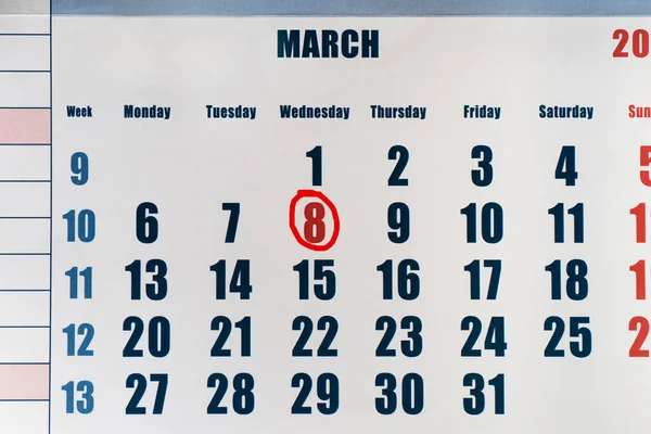 The holiday is March 8 in the calendar.Calendar with a circled date of March 8.